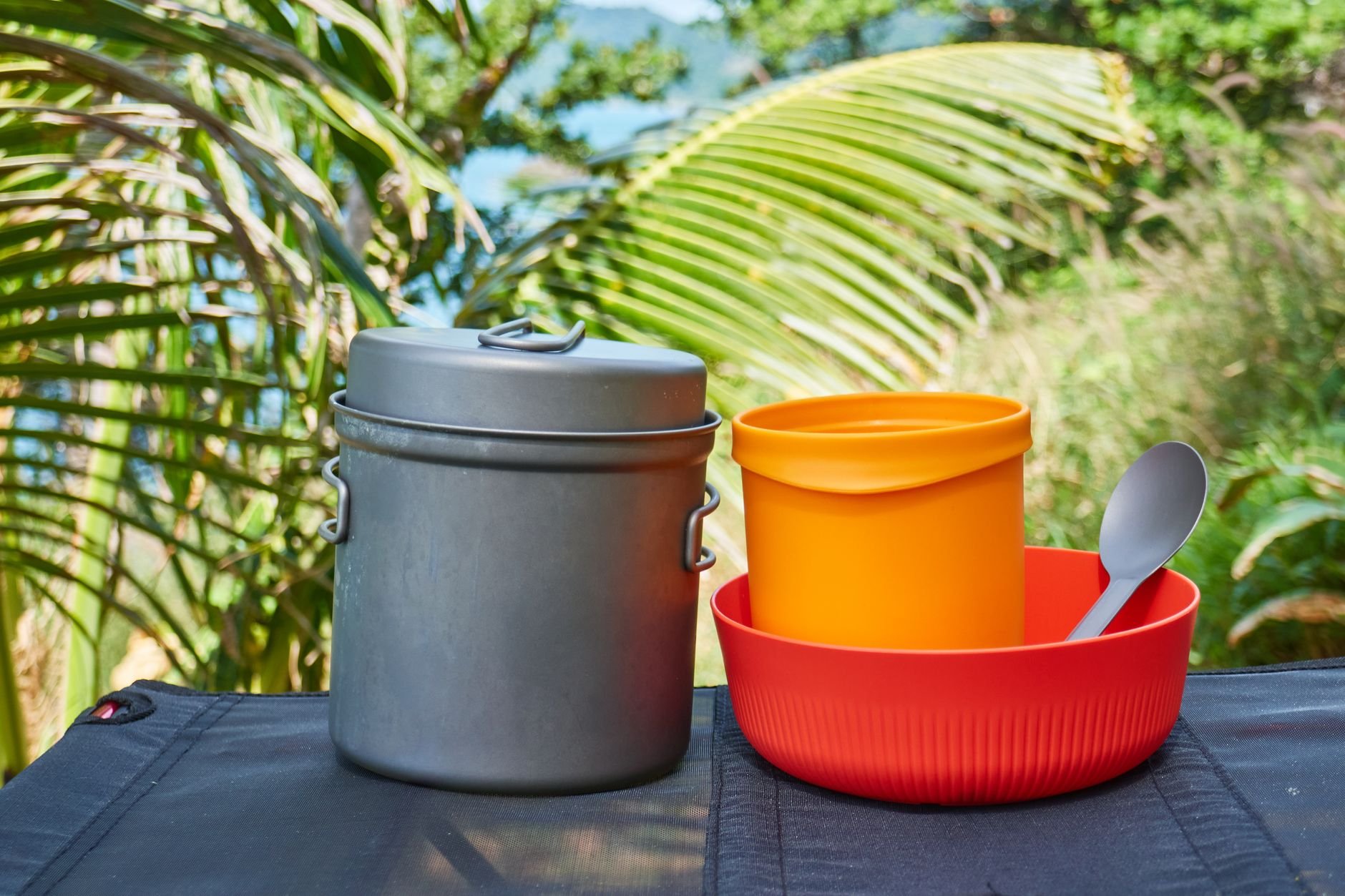 Camp cookware set with pots, pans, and bowls for hunting camp outdoor cooking