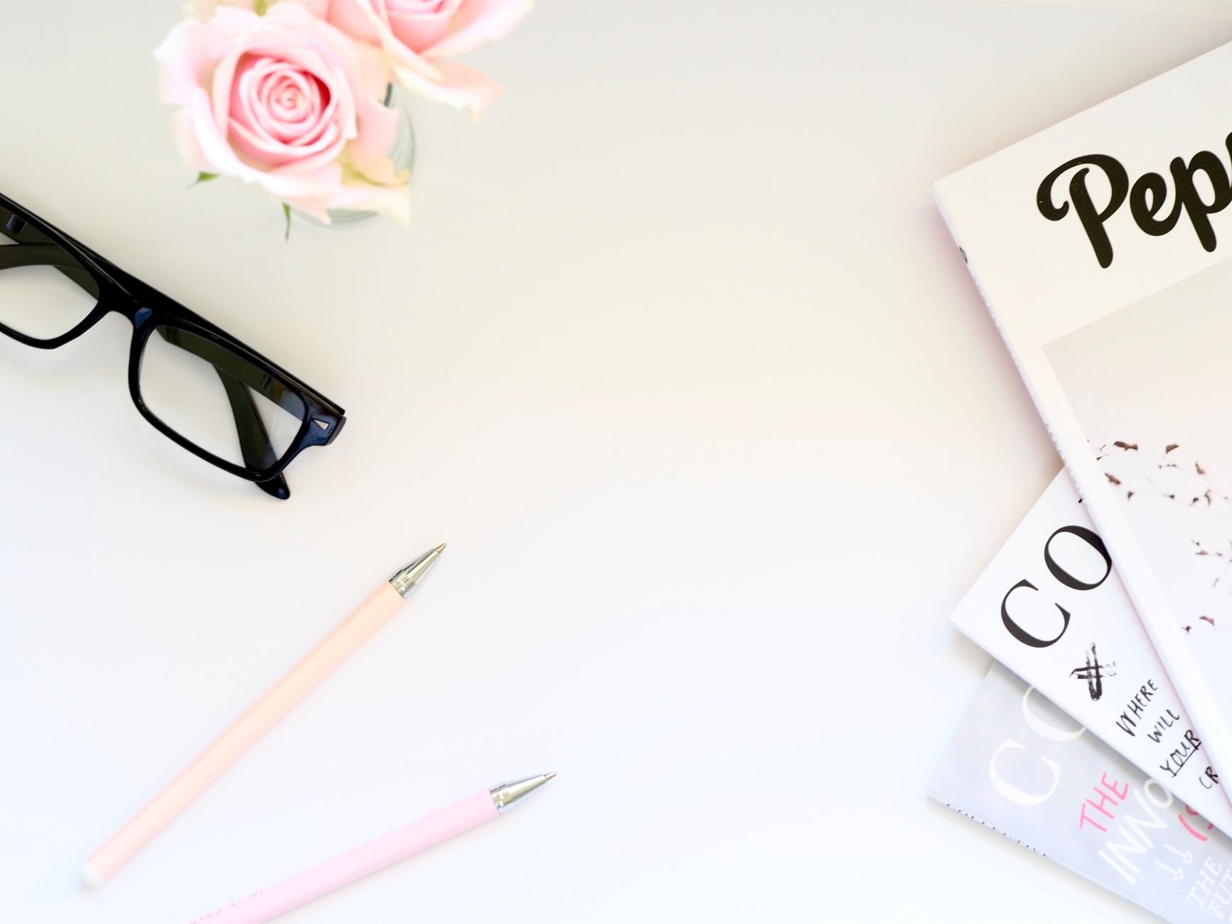 Curated home décor flat lay with magazines and styling accessories