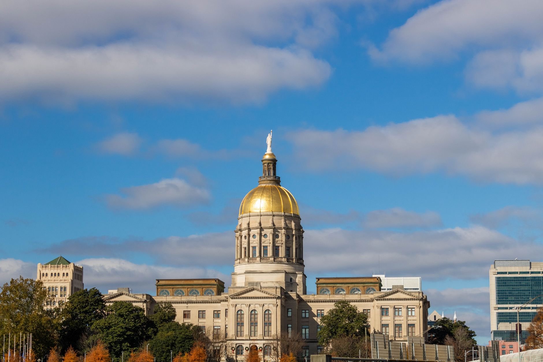 State Capitol building with golden dome under blue sky