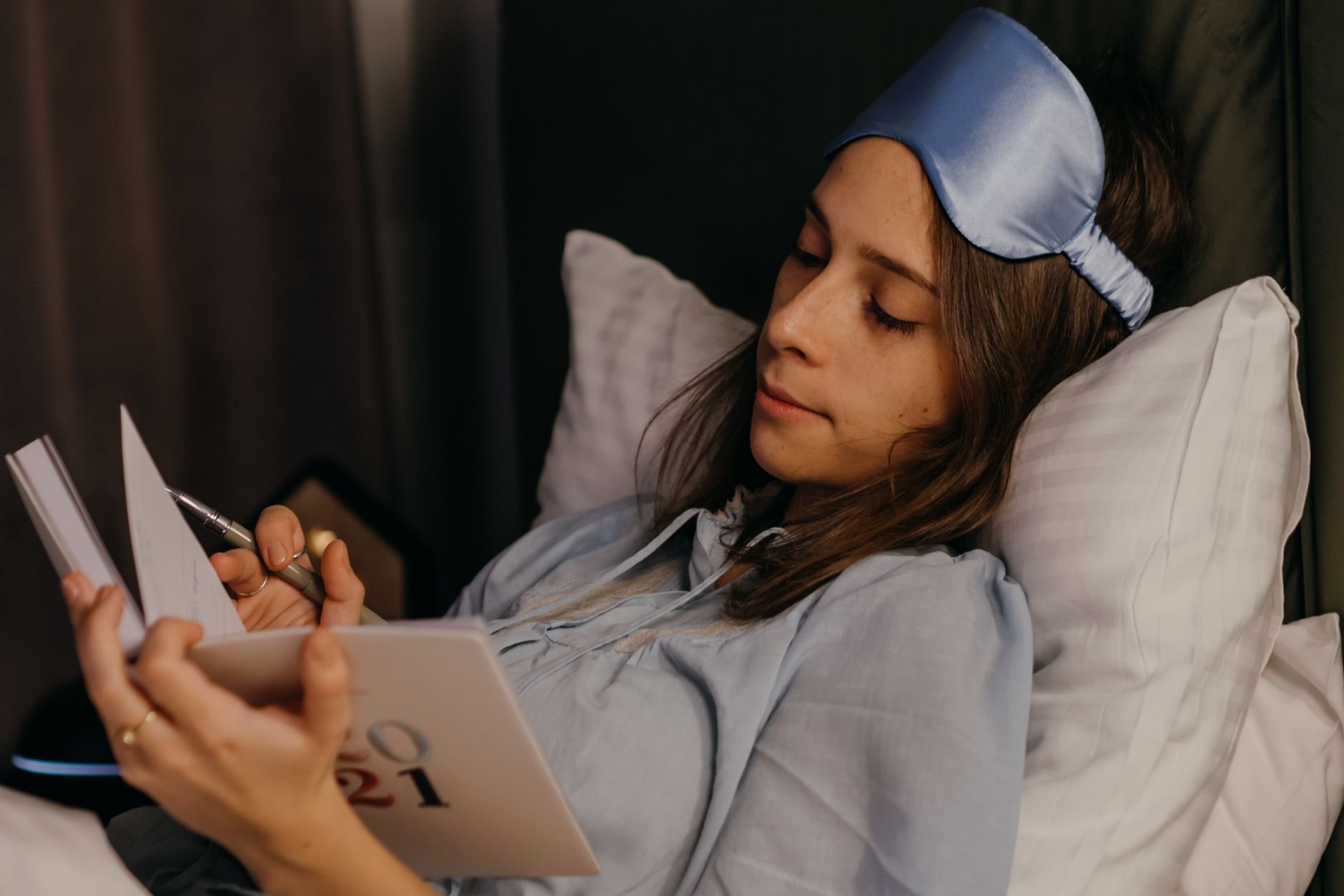 Woman journaling wellness progress