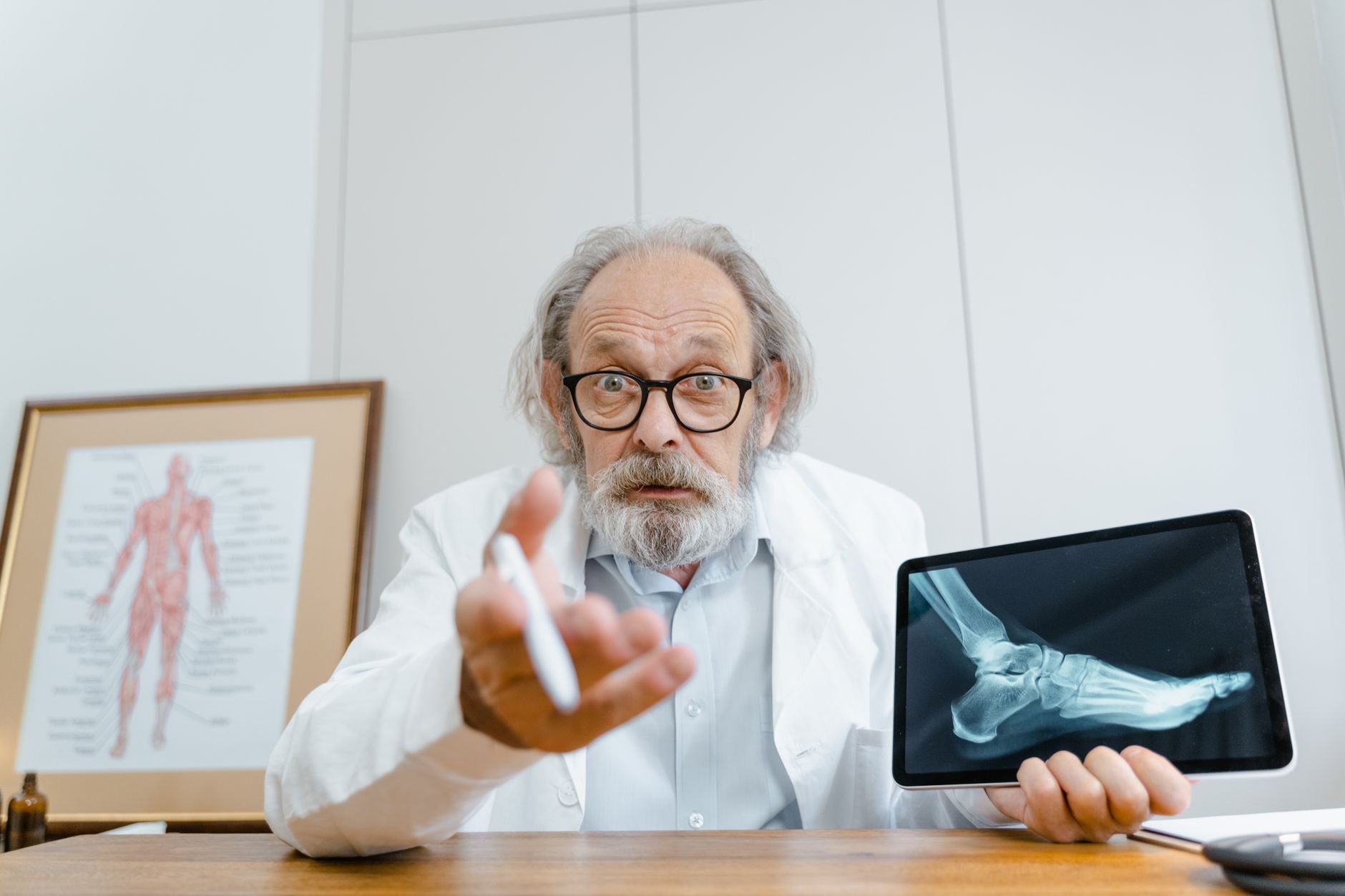 Doctor consulting patient on tablet