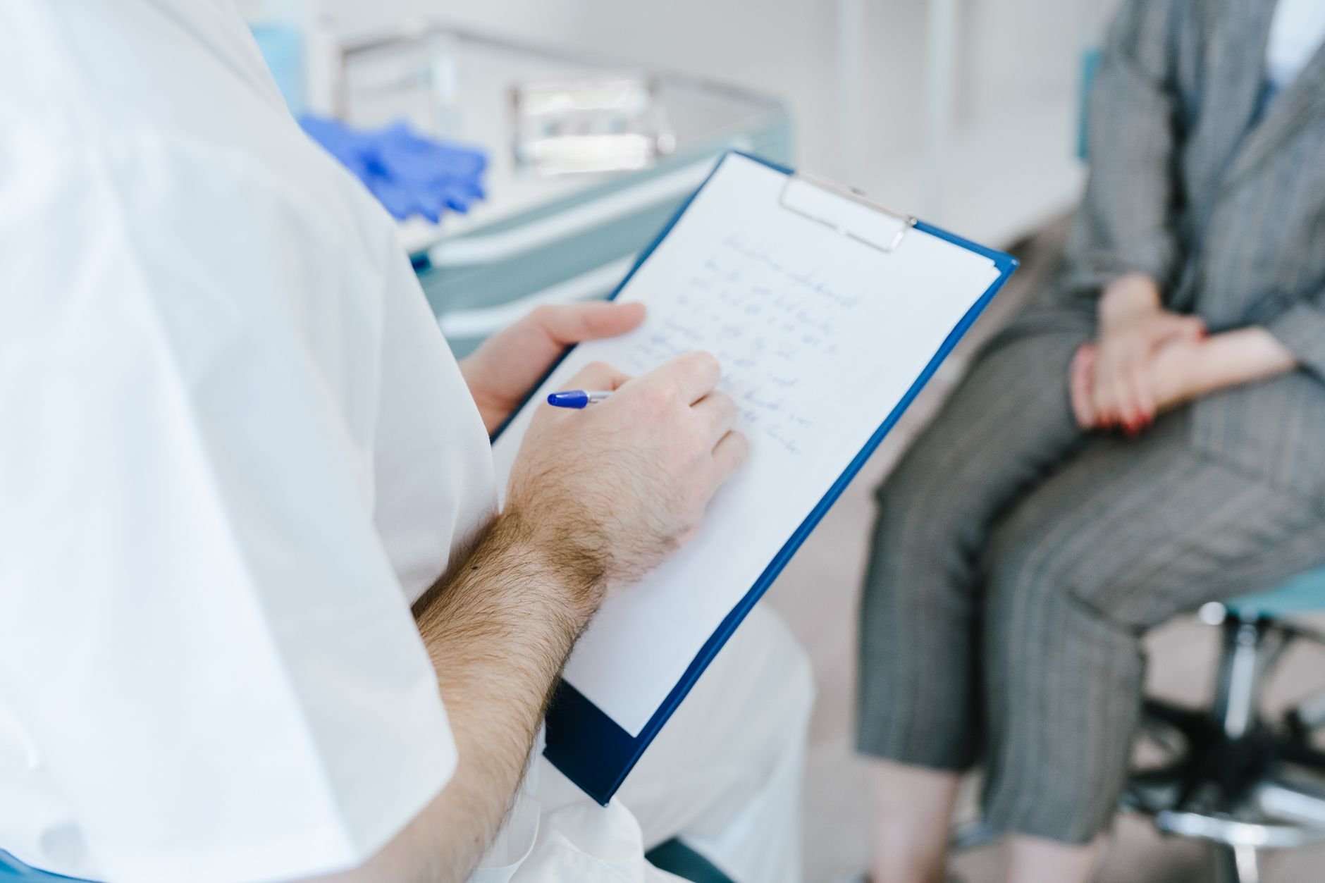 Medical professional writing patient notes