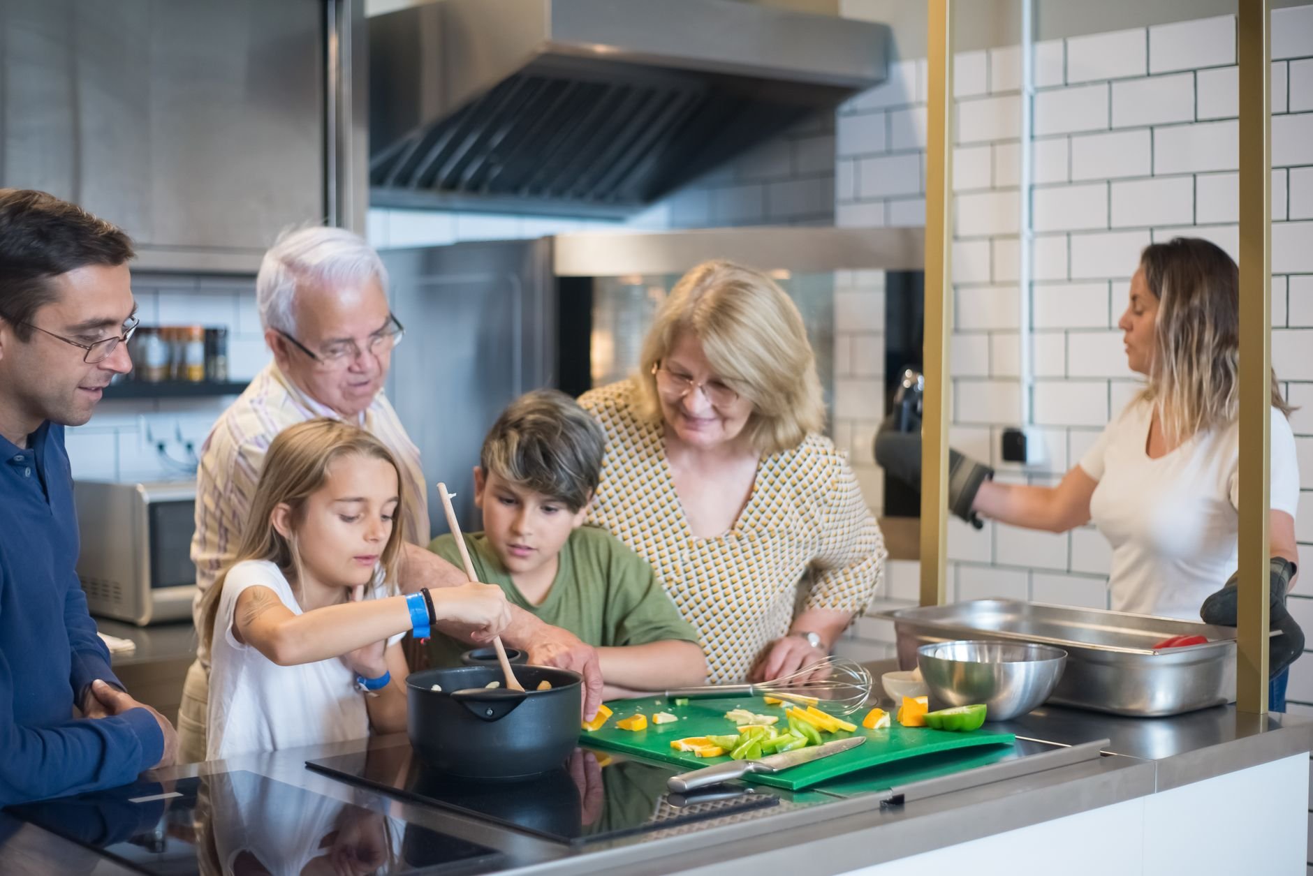 Multi-generational family enjoying cooking together