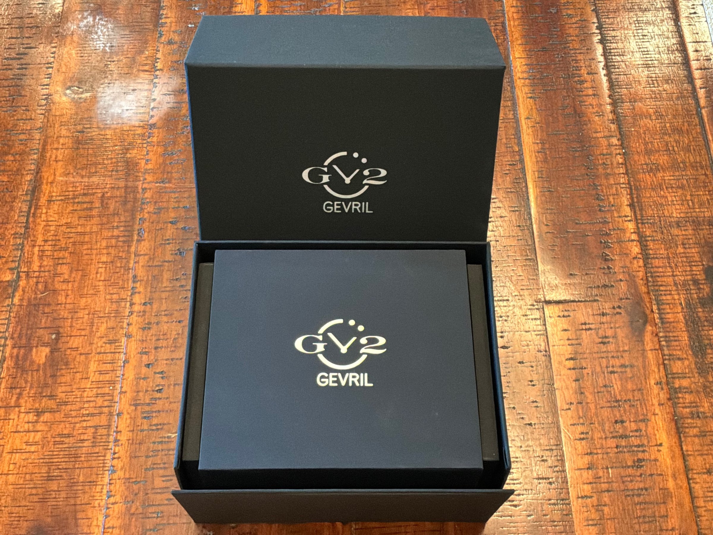 GV2 by Gevril outer shipping box open revealing inner watch presentation box with gold logo