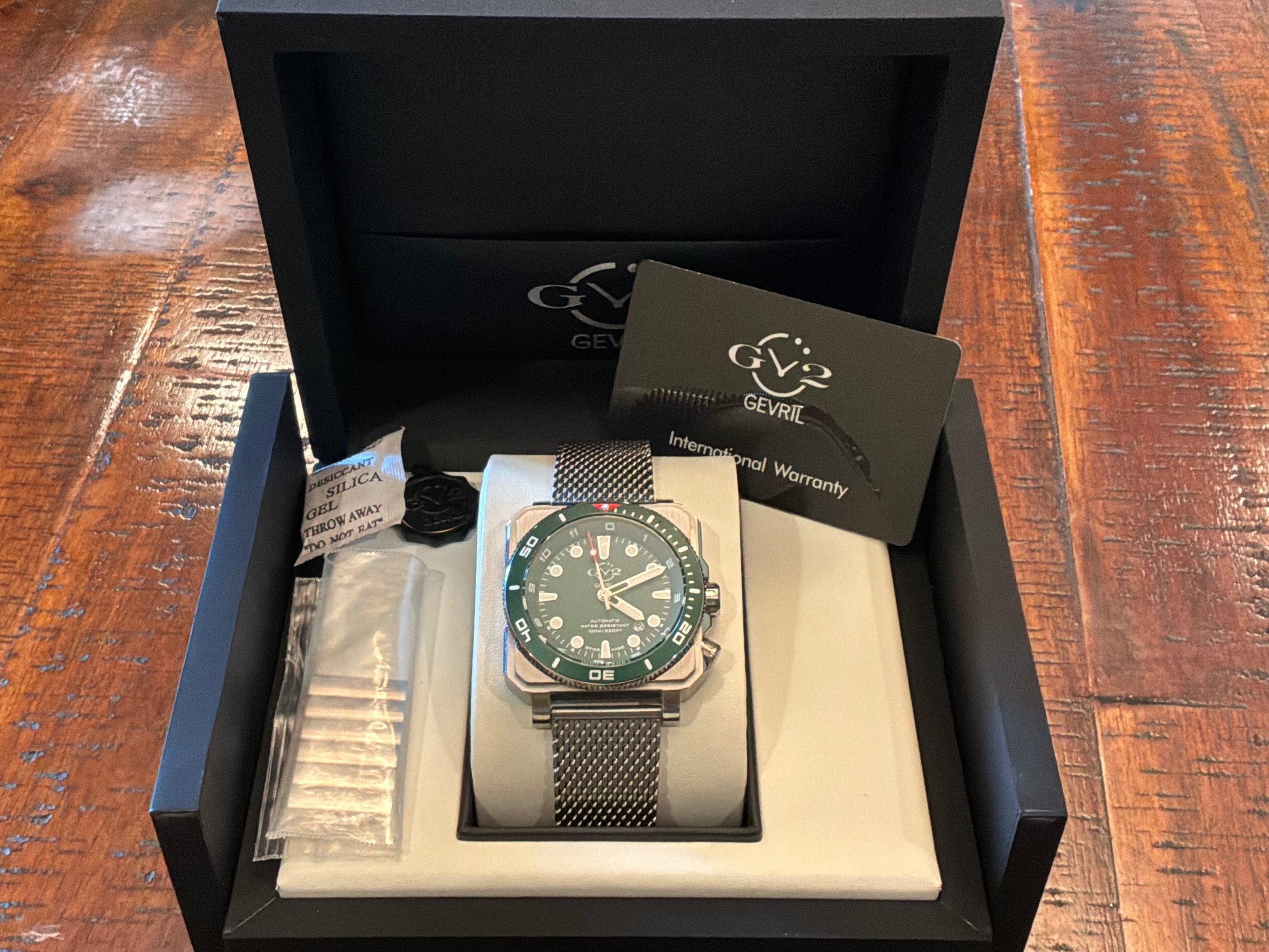 GV2 by Gevril XO Submarine green diver watch with mesh bracelet displayed in open box