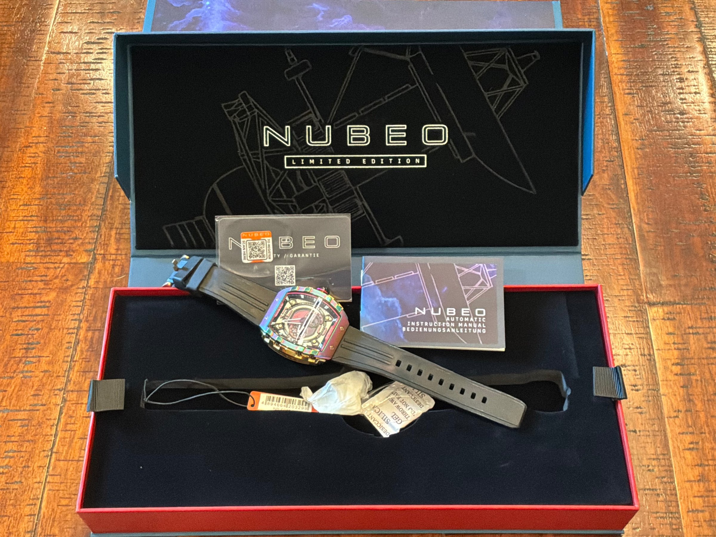 Nubeo Magellan Limited Edition automatic watch with rainbow PVD case displayed in original presentation box
