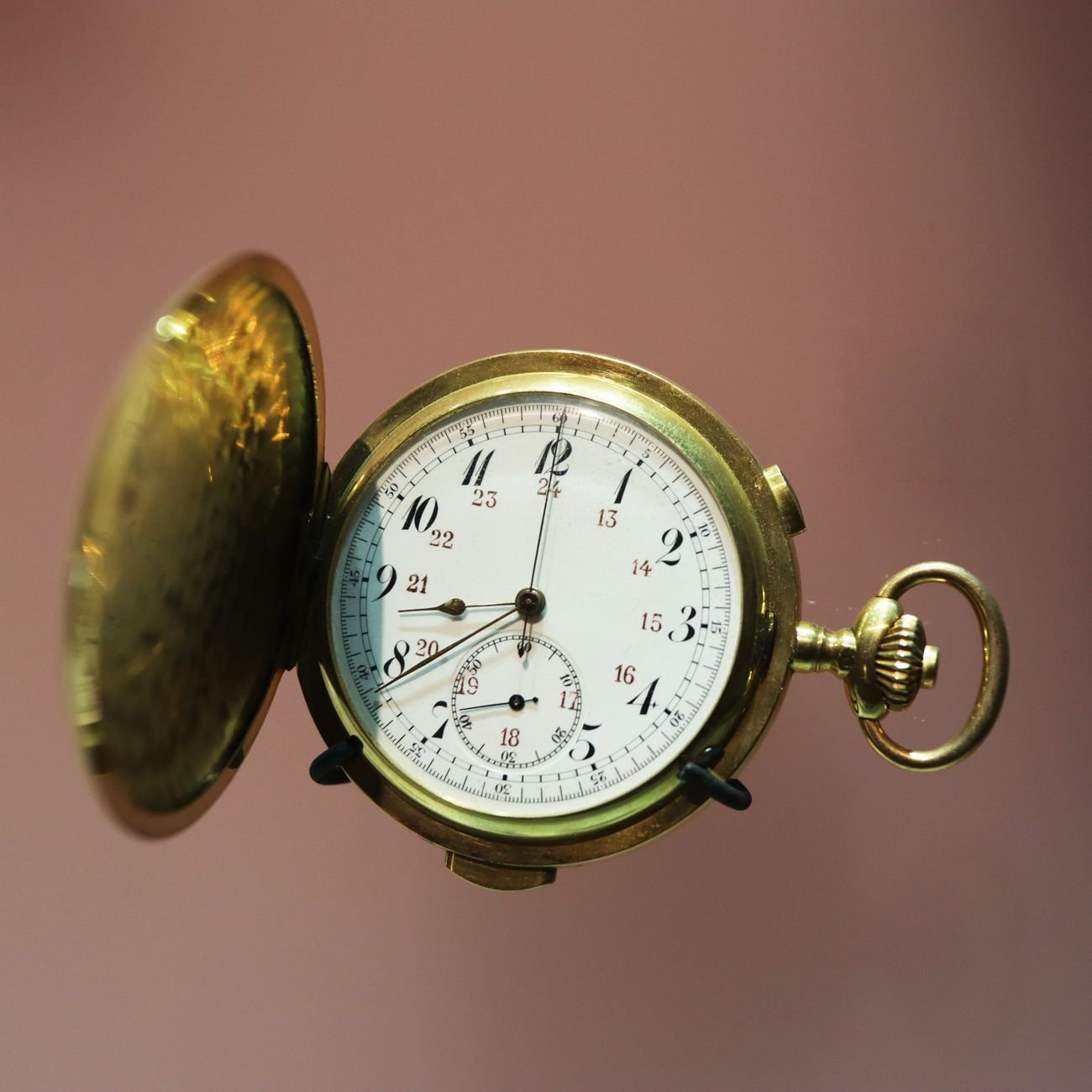 Vintage gold pocket watch with exposed clock face