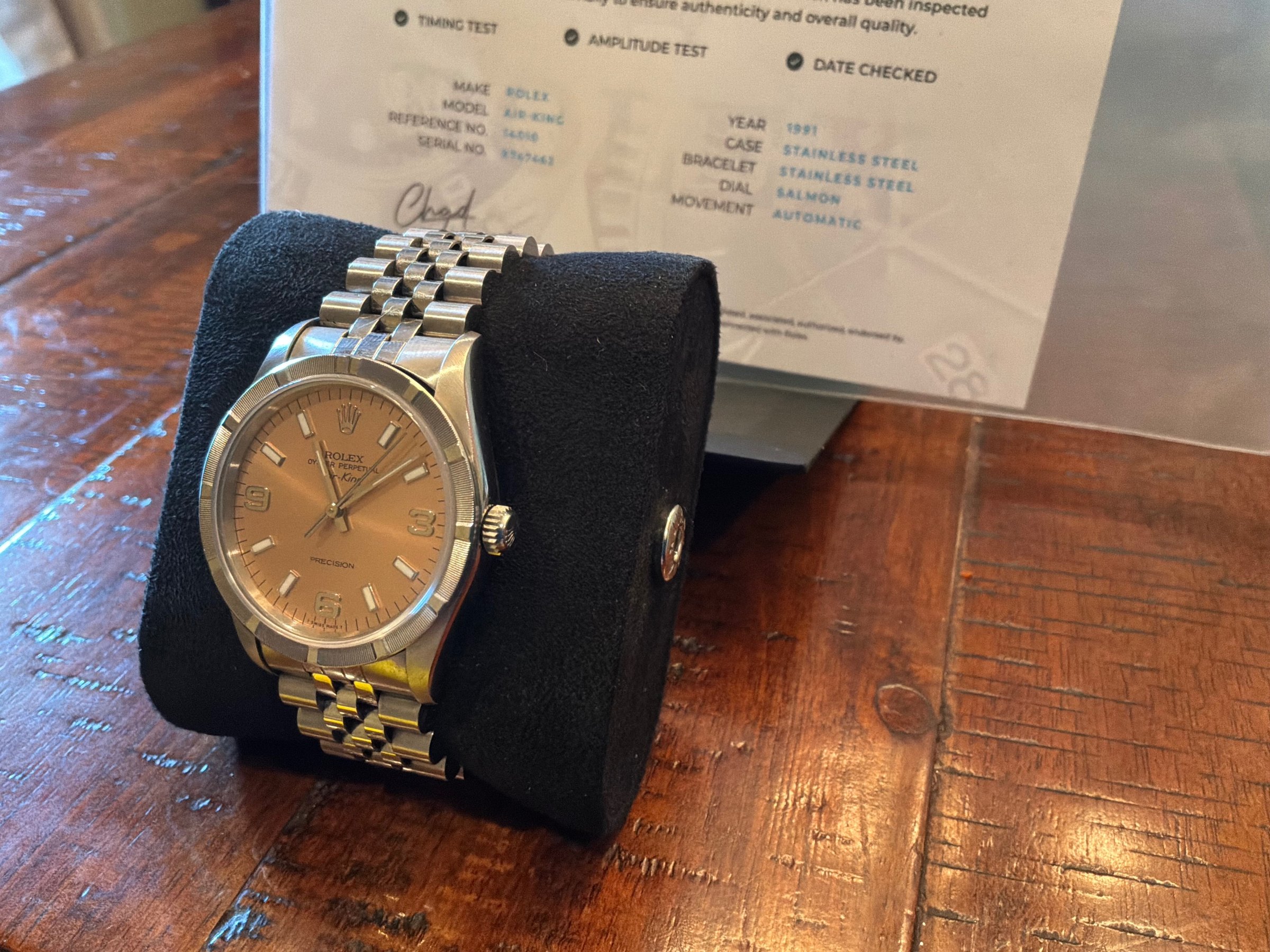 1991 Rolex Air-King Ref. 14010 salmon dial side angle view with Watch Gang authenticity certificate