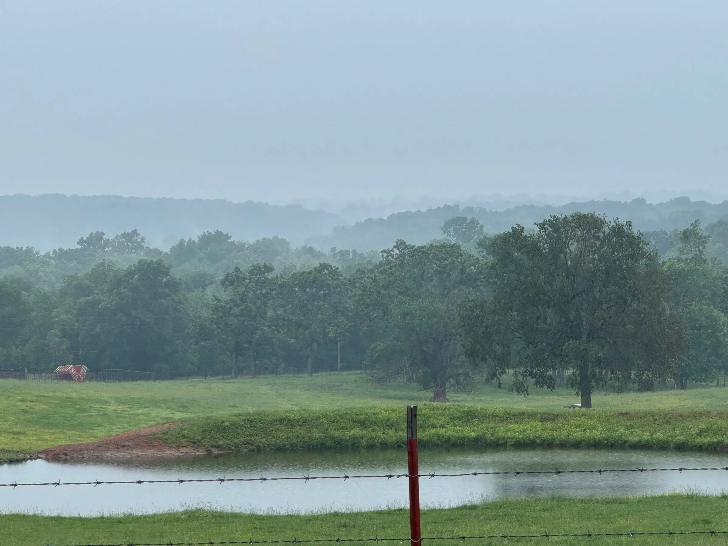 Misty morning over the Ozark hills near Pineville, Missouri